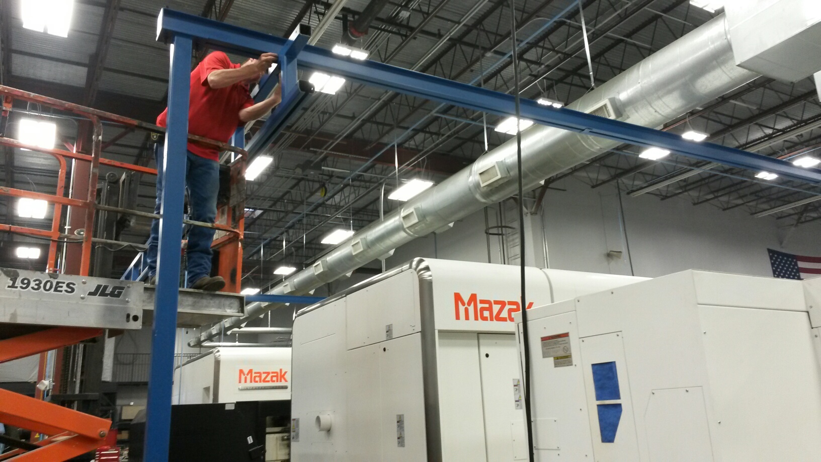 Gorbel Workstation and Jib Crane System Designed for Loading and Unloading Heavy Equipment for the Energy Industry in a CNC Machine Shop in Dallas, TX