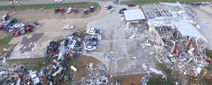 Severe tornado damage to auto dealership in TX.